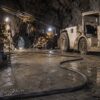 three-conductor-round-type-w-cable-600-2000v-Scene Type W cable routed beside loaders and drilling equipment in an underground mine