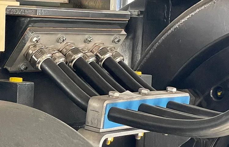 Flexible DLO-style power cables connected at industrial equipment