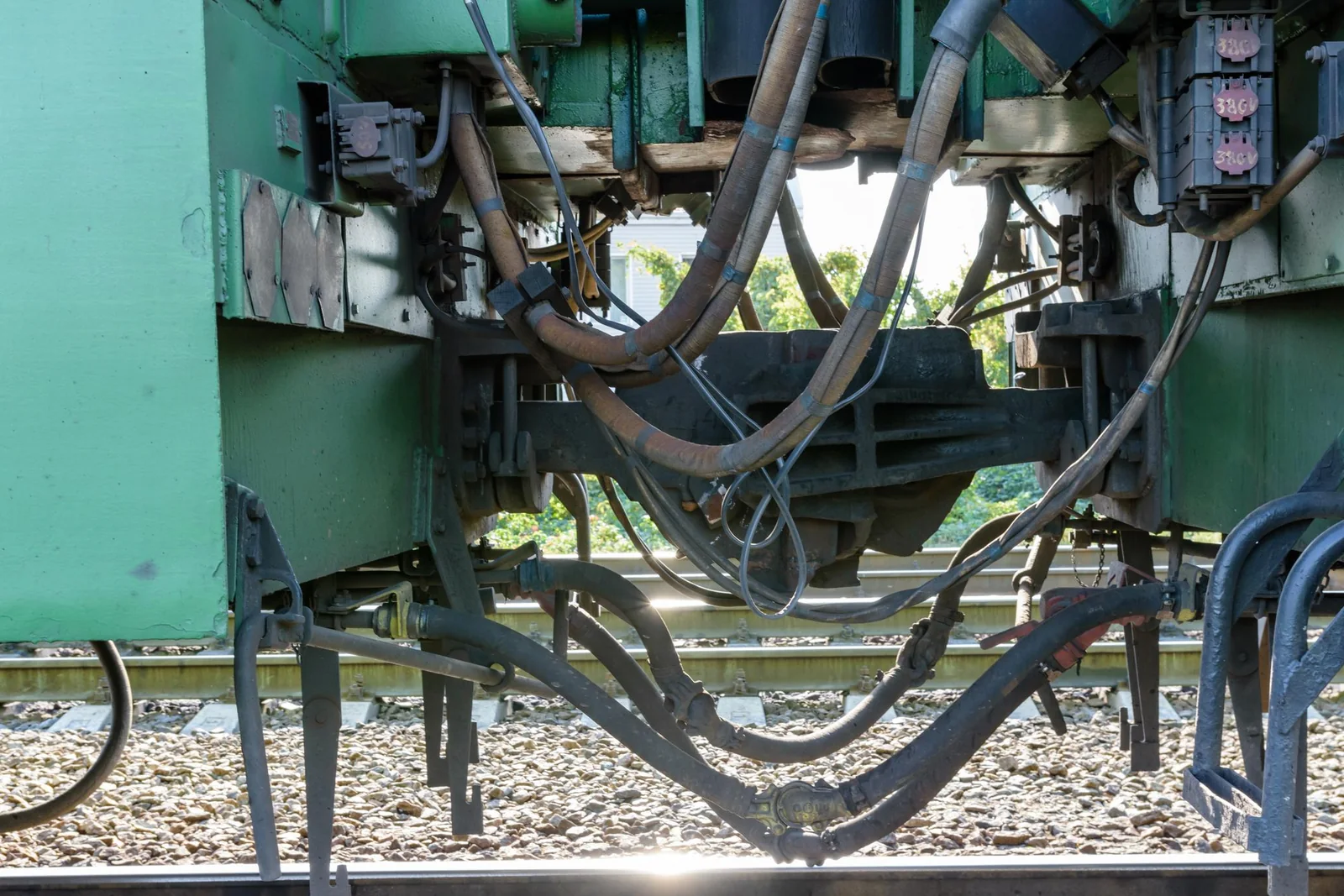 Flexible cable connections beneath a diesel-electric locomotive
