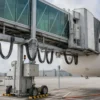 400Hz Passenger Boarding Bridge Drag Chain Cable Application Passenger boarding bridge with suspended moving cable loops at an airport aircraft stand