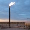flare stack ignition Wellsite flare stack burning at dusk with guy wires, separator vessel and tank battery, the run a flare stack ignition cable makes from grade to the flare tip