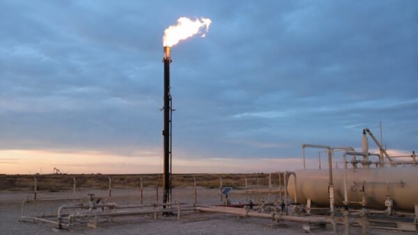 flare stack ignition Wellsite flare stack burning at dusk with guy wires, separator vessel and tank battery, the run a flare stack ignition cable makes from grade to the flare tip