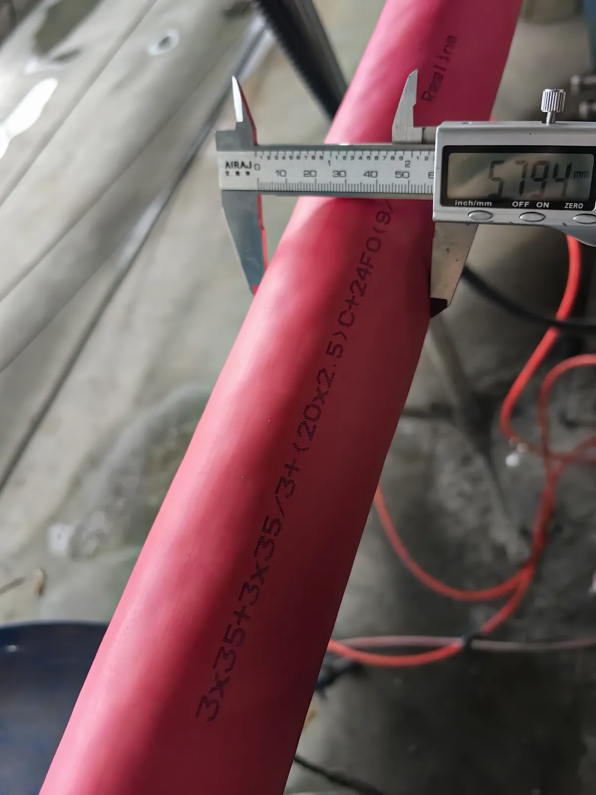 Caliper reading 57.94 mm on the 3x35 + 3x35/3 reeling cable, tender window 56 to 59 mm