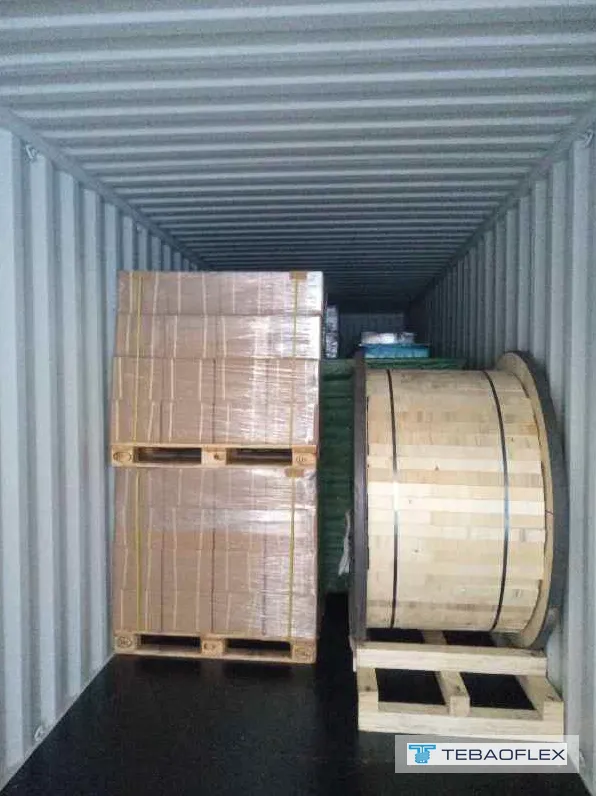 Wooden cable drums and cartons loaded in a container bound for Singapore