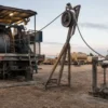 Monoconductor wireline cable at wellhead Monoconductor wireline logging cable running over a sheave at a wellhead during downhole logging
