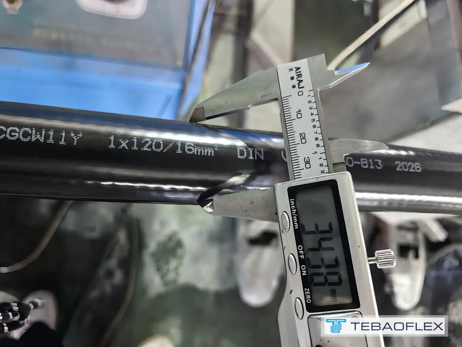 Caliper reading 34.38 mm next to the (N)TMCGCW11Y 1x120/16mm2 DIN VDE 0250-813 sheath print