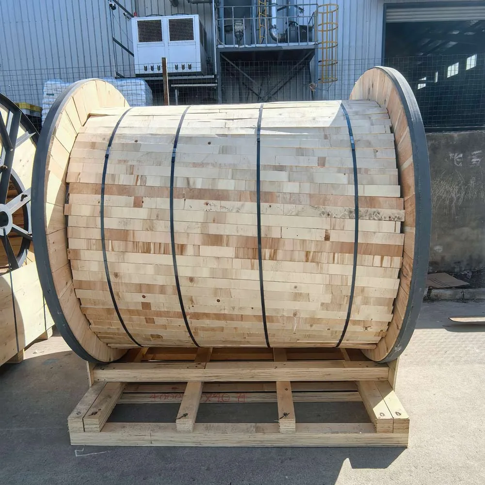 Wooden cable drum with protective timber battens and securing straps on a pallet at TEBAOFLEX