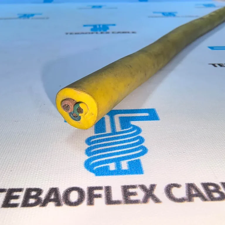 Yellow three-core cable sample with an intact outer jacket on a TEBAOFLEX-branded sample mat