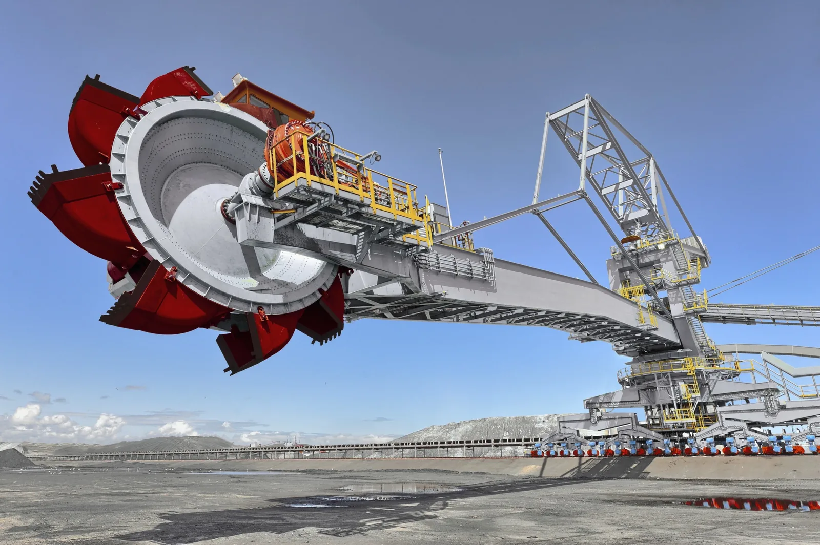 A rail-mounted bucket-wheel stacker-reclaimer on a bulk material stockyard