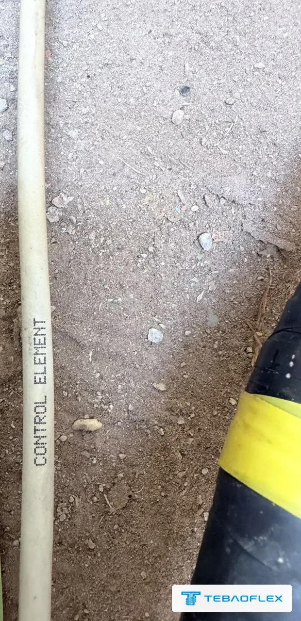 White core of the existing pump cable printed CONTROL ELEMENT, next to a power core with yellow phase tape