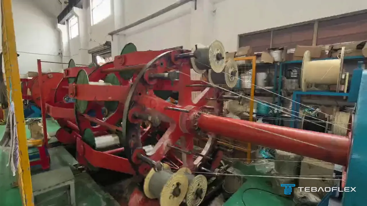 Cage stranding machine with wire bobbins laying up a fine-wire tinned copper conductor at the TEBAOFLEX factory
